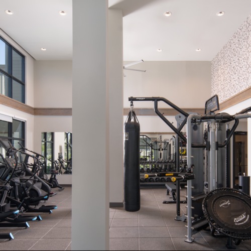 two story fitness center with ample workout equipment