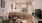 living room looking towards kitchen with bar stools 