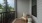 screened in porch with a table and chair