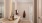 bathroom with white counter and backlit mirror